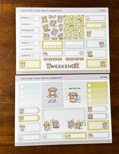 Reviewer's photo of a 'Highland Cows Mini Planner Kit' with weekly layout stickers and decorative cow illustrations.