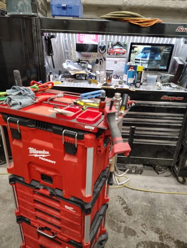 Customer's Tequila Moto Rods and other tools on a red toolbox in a professional workshop setting.