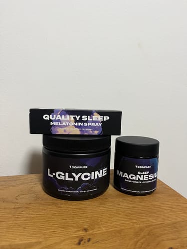 Customer's Better Sleep Bundle products—L-Glycine, Magnesium, and Melatonin Spray—arranged on a wooden surface.