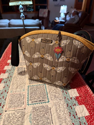 Customer's finished quilted bag with a bee pattern, sewn using the Jeans Foot on a patterned quilt.