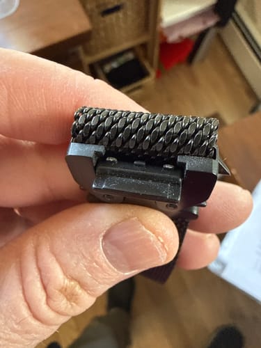 Customer's close-up of the broken clasp on the black Titanium Milanese Loop Strap.