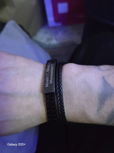 Customer showing their engraved black Double Row Box Link ID Bracelet on their wrist, next to another bracelet.