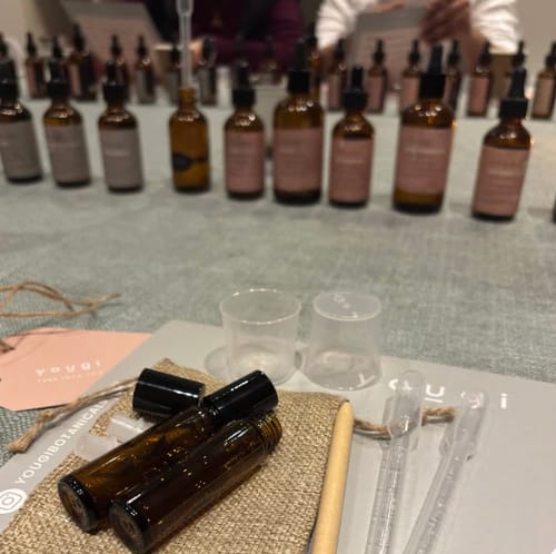 Reviewer's station at the Perfume Making Workshop, with empty amber bottles and pipettes ready for blending essential oils.