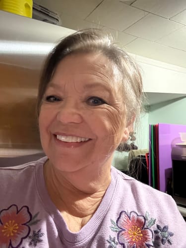 Reviewer with a bright, happy smile while wearing her custom Pop On Veneers.