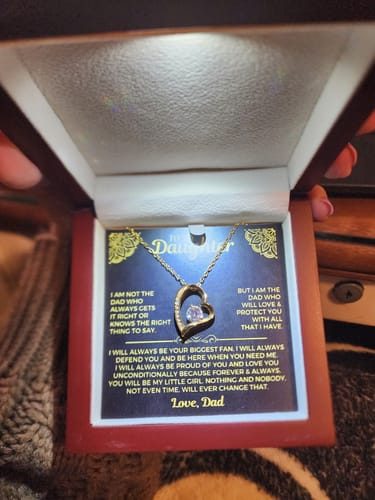 Customer's 'To My Daughter' gift set in an open mahogany box with an LED light shining on the heart necklace and message card.