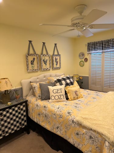 Customer's bedroom showing subtle yellow paint on the walls and ceiling.