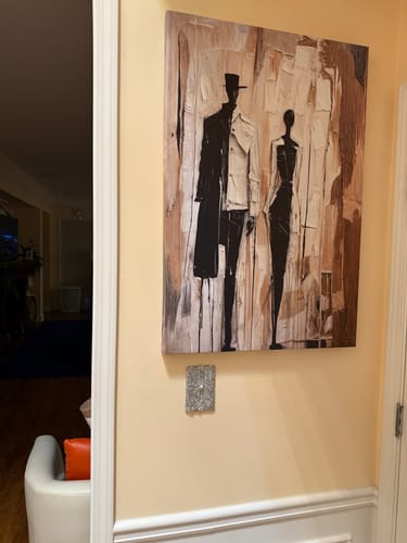 Reviewer's Modern Abstract Couple Wall Art hanging on a light-colored wall in their hallway.