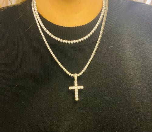 Customer wearing the ICE BREAKER CHAIN layered as a choker above a second tennis necklace with a cross.