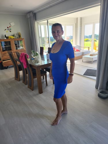 Reviewer showing the body-hugging fit of the blue Short Sleeve Midi Shapewear Dress.