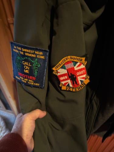 Customer photo review of Call on Me Brother Badge
