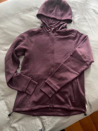 Customer's purple Cubby Hooded Sweatshirt laid flat, fully zipped with the hood displayed.