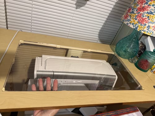 Customer's clear Sew Steady insert fits perfectly in a sewing cabinet, creating a solid surface over the machine.