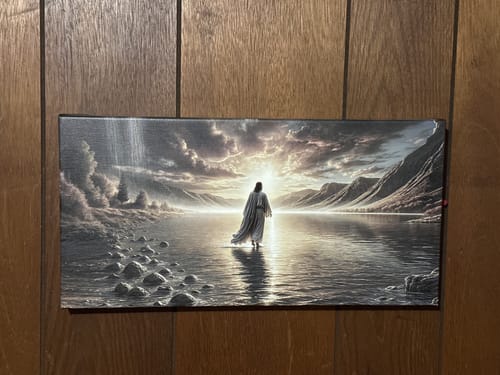 Reviewer's 'Walking on Water' faith wall art hung on a wood-paneled wall.