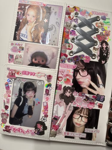 Customer's white BALLERINA COQUETTE BINDER open and heavily decorated with cute stickers and several photos.