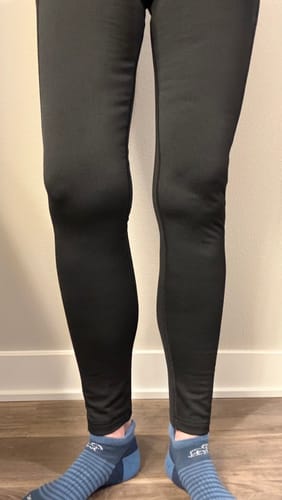 Reviewer showing the full-length fit of the black Merino Flex® McKenna Tall leggings.