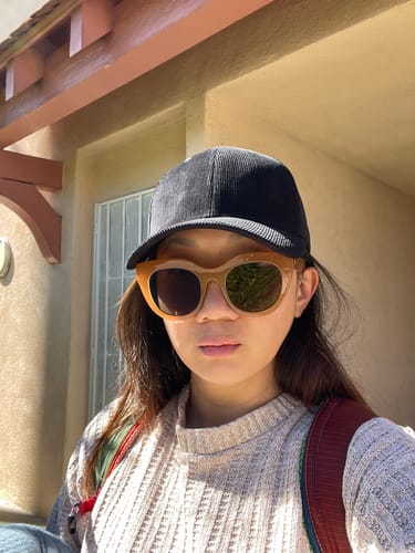 Customer's "after" photo, happily wearing the black Big Structured Corduroy Cap which fits well.