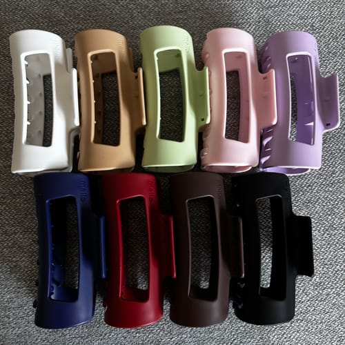 Customer's collection of colorful cloud clips in nine different colors arranged in two rows.