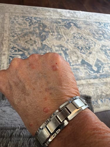 Customer wearing the silver link Iron Man Titanium Magnetic Bracelet on their wrist.