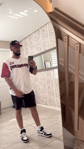 Customer taking a full-length mirror selfie wearing the Dominican Republic Heritage Custom Baseball Jersey.