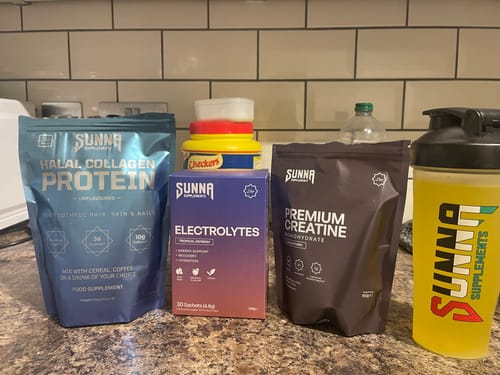 Customer's Ramadan Bundle including Halal Collagen Protein and other supplements arranged on a kitchen counter.