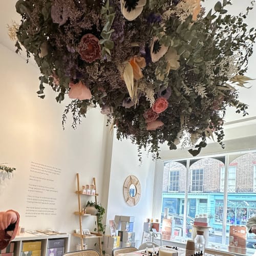 Reviewer's photo of the beautiful studio for the Perfume Making Workshop, featuring a large dried floral installation.