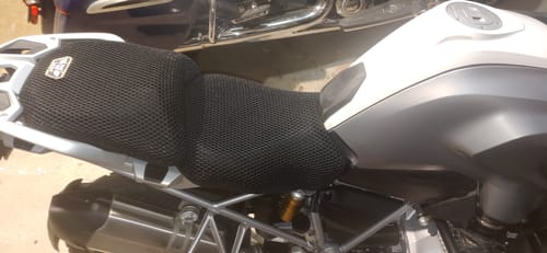 Customer's black mesh Wind Rider Seat Cover installed snugly on a motorcycle, covering both passenger and driver seats.