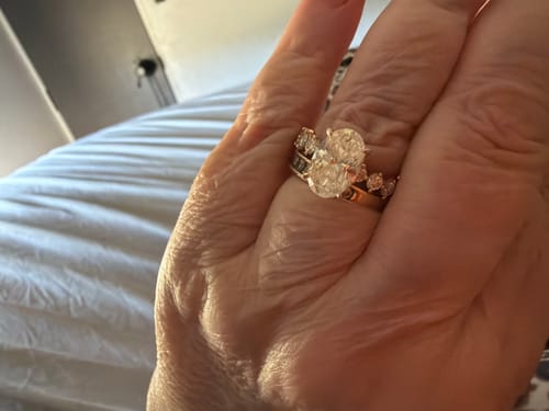 Reviewer's hand wearing the custom 4.5 karat gold Celestine ring.
