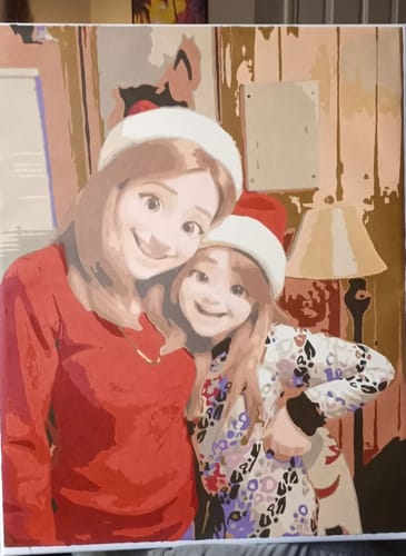 Customer's finished Cartoon Portrait Paint by Numbers Kit showing a cartoon-style painting of two smiling people in Santa hats.