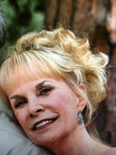 Close-up of a reviewer's smiling face, showing the effects of the Tallow & Honey Balm.