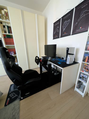 Reviewer's PRIME Lite Cockpit shown fully assembled as a racing simulator in a home setup.
