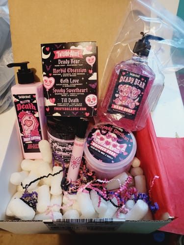 Customer's view inside their February Monthly Subscription Box, filled with spooky, pink bath and body products.