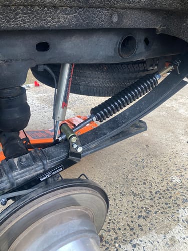 Customer's close-up of the HD Kit installed on the rear leaf spring suspension of their Chevrolet 1500.