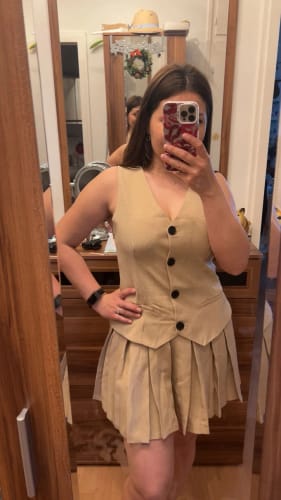 Customer photo review of Cheryl Sleeveless Pleated Mini Dress