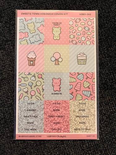 A customer's Sweets Town Hobonichi sticker sheet with cute candy and bear designs in its original packaging.