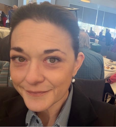 Reviewer's face close-up showing natural skin texture before using the Grass Fed Tallow & Honey Balm.