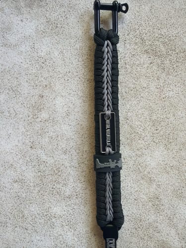 Customer's black and grey Paracord Bracelet with an Until Valhalla plaque and black metal clasp.