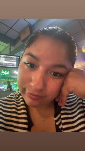 Reviewer's selfie showing off their soft and voluminous Manga lashes.