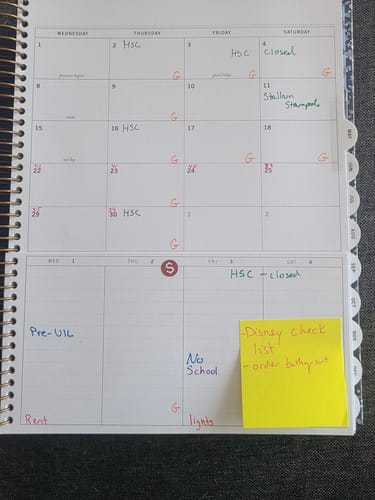 A customer's Scout Planner is open, showing the monthly calendar and weekly schedule layout filled with handwritten plans.