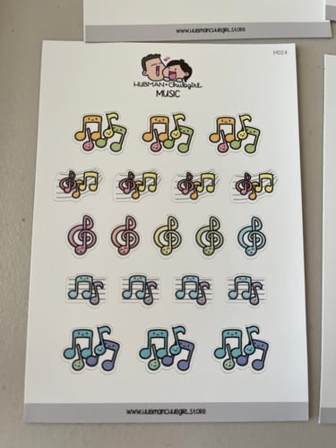 Customer's full sheet of Music Planner Stickers, showing cute, colorful musical notes and clefs.