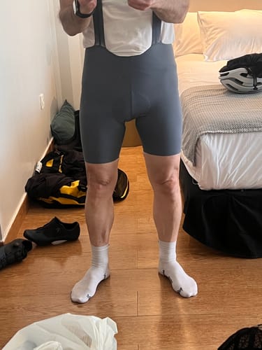 Reviewer standing indoors wearing the snug, gray LIFTTINT 2.X BIB SHORTS.