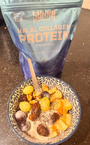 Customer's bag of Halal Collagen Protein behind a breakfast bowl topped with fresh fruit and seeds.