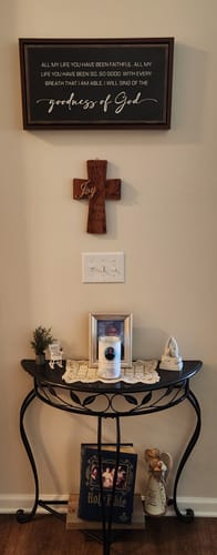Customer's framed Goodness Of God Faith Sign II hanging on a wall above a console table with other faith decor.