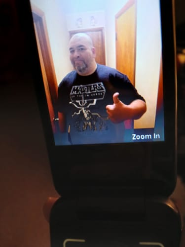Customer wearing the black Retro He-Man Masters of the Universe T-Shirt while giving a thumbs-up.