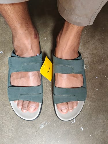 Customer wearing the dark green Frido dual strap sandals, showing the fit on their feet.