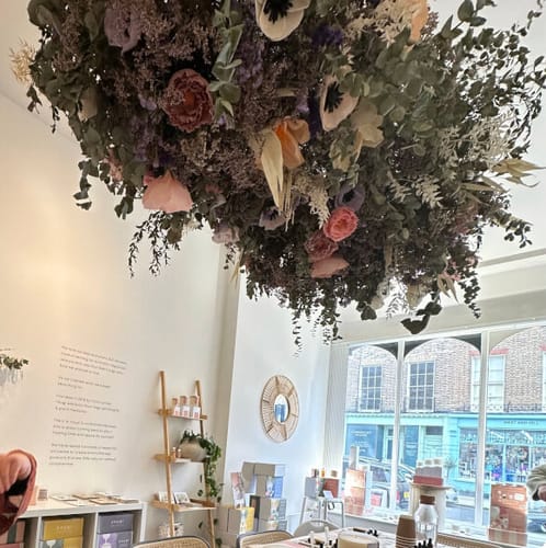 Reviewer's photo of the Perfume Making Workshop studio, showing a large, beautiful dried flower arrangement hanging from the ceiling.