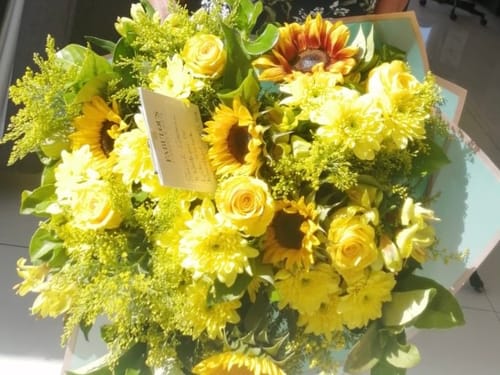 Customer's beautiful Natasha's Flower Bouquet, a vibrant mix of sunflowers and other yellow flowers.