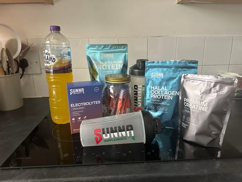 Customer's Ramadan Bundle products, including protein and electrolytes, displayed on a kitchen hob.
