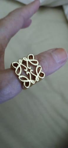 Close-up of a customer wearing the gold Geometric Ring on their thumb.