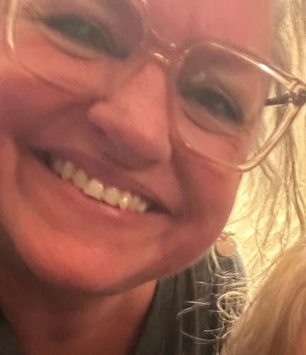 Close-up of a reviewer smiling, showing the skin results after using the Seranova Microneedling Infusion System.