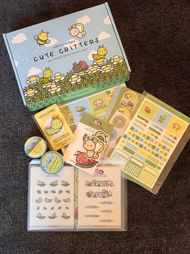 Reviewer's Ultimate Subscription box and its 'Cute Critters' themed contents, including stickers and washi tapes.